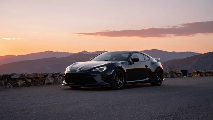 Why a Black Coupe Pops Against a Fiery Sky