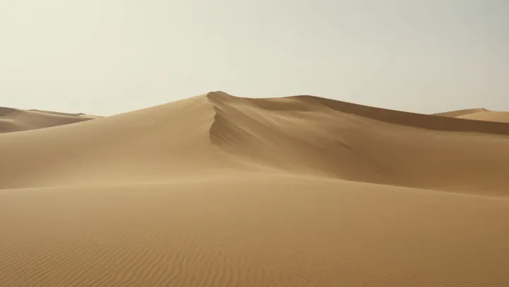 How Dry Sand Sharpens Itself Into Ridges