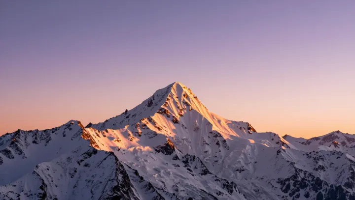 Why Mountain Snow Glows While Valleys Sulk