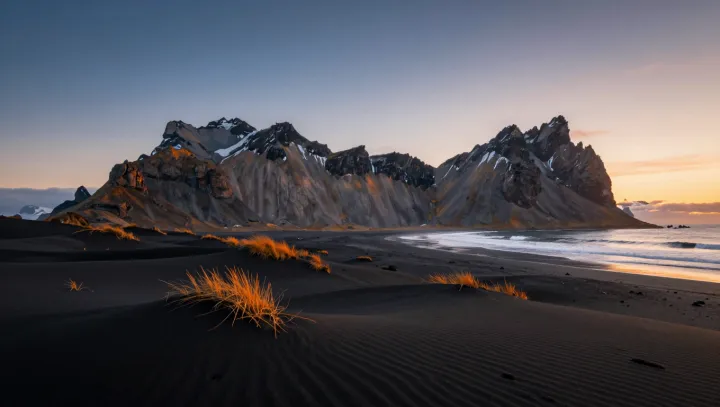 Volcanic Engines Behind Black Sand and Gold Peaks